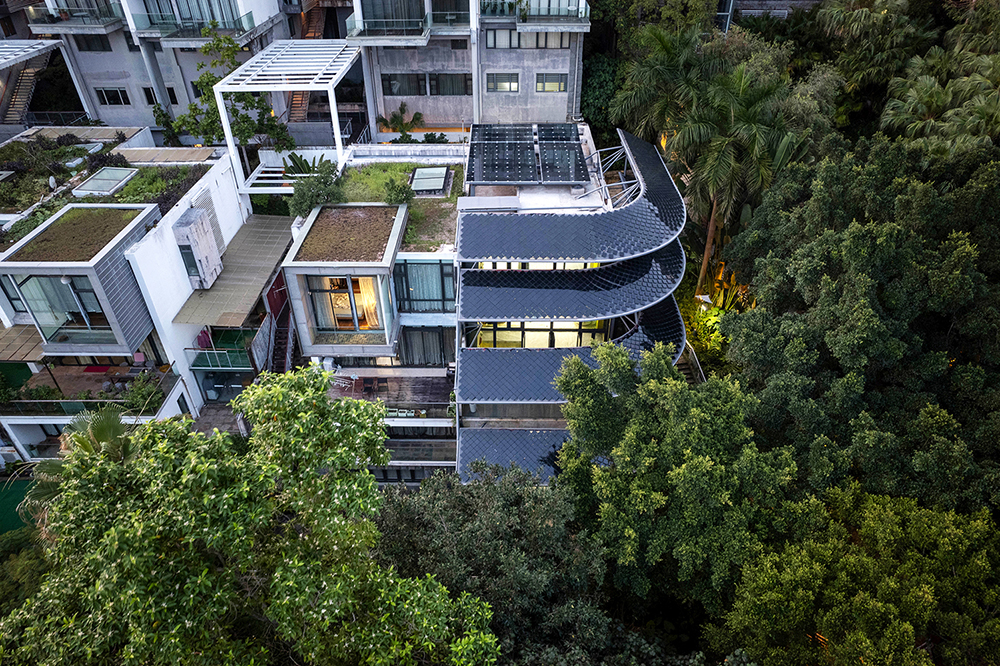 Positive Energy House Shenzhen exterior showing sweeping curved solar roofs integrated into architecture